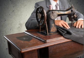 Tailor. Tailor at work. Top view of confident young tailor
