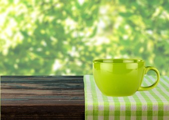 Kitchen. Empty wooden table covered with red checked tablecloth