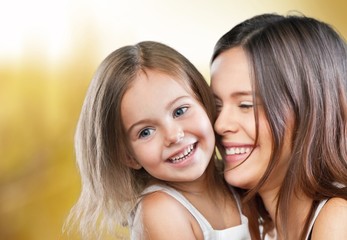 Fototapeta premium Mum. Mother and Baby kissing and hugging at Home. Happy Smiling