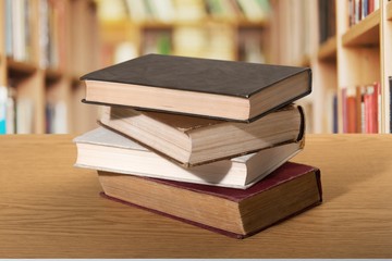 Book. A pile of books with library on the back