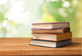 Summer. Old vintage books over beautiful bokeh background