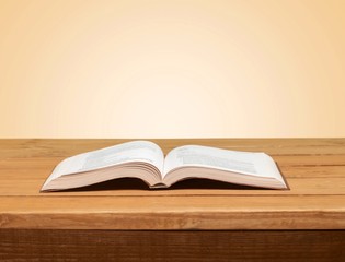 Book. Open book on wood table over grunge background