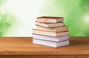 Book. Vintage old books on wooden deck tabletop against grunge