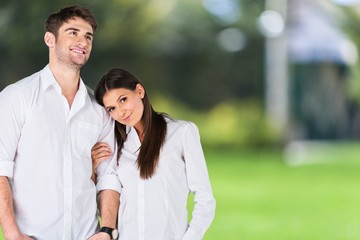 Home. Young couple standing on white background