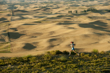 Caucasian woman running in remote area