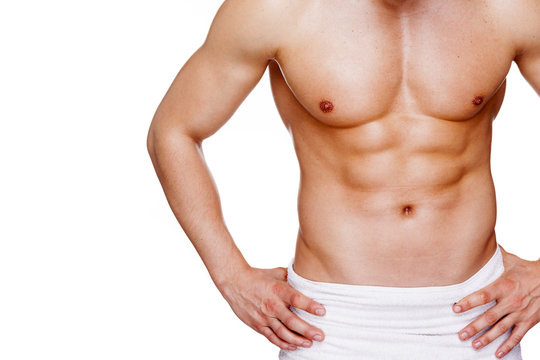 Athletic muscular man in towel, isolated over white background