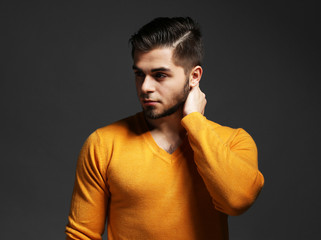 Obraz premium Portrait of young man on gray background