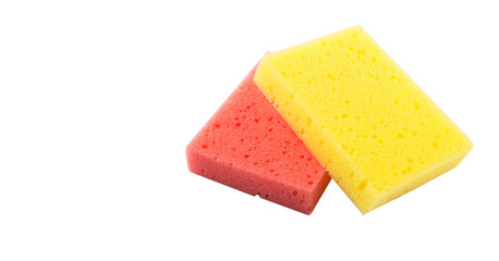 Red and yellow dish washing sponge over white background