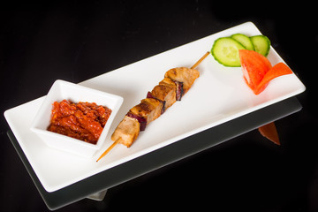 Grilled skewers with vegetables and sauce