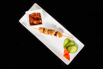 Grilled skewers with vegetables and sauce