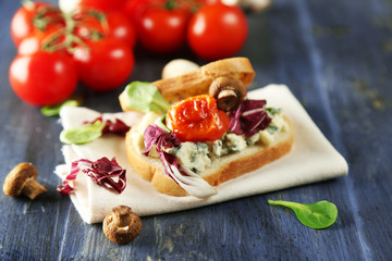 Fototapeta na wymiar Tasty sandwich on wooden table, close up