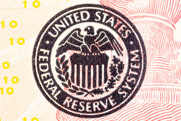 Federal Reserve icon on a ted dollar bill.