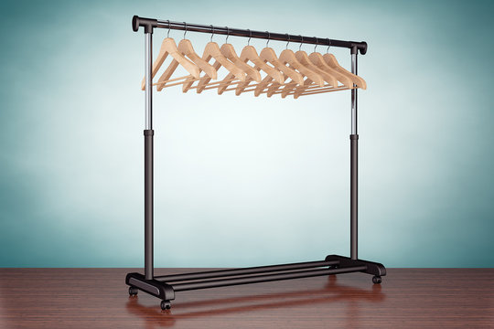 Old Style Photo. Mobile black coat rack with hangers