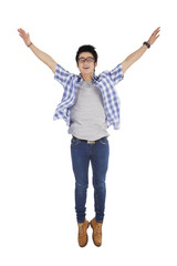 Excited man leaps in the studio