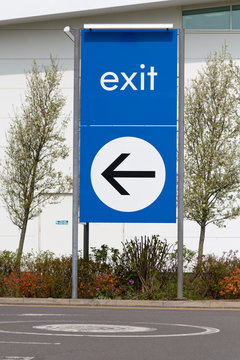 Exit sign with direction arrow