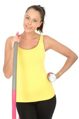 Healthy Young Woman Holding a Dumb Bell and Hula Hoop