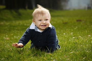 Little boy on spring meadow
