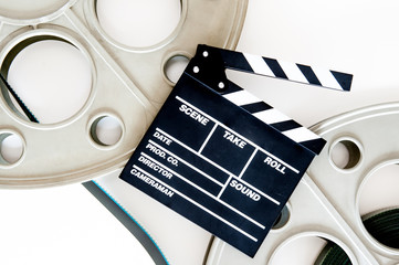 Two movie reels for 35 mm film projector with clapper board and