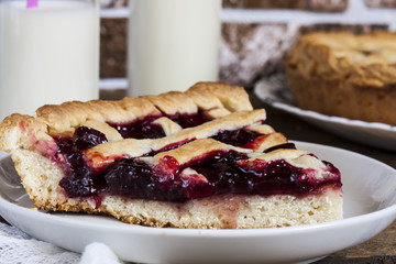 Homemade cherry pie on wooden table
