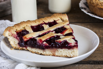 Homemade cherry pie on wooden table