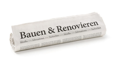 Zeitungsrolle mit der Überschrift Bauen und Renovieren