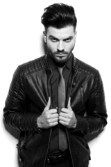 business man pulling his jacket together