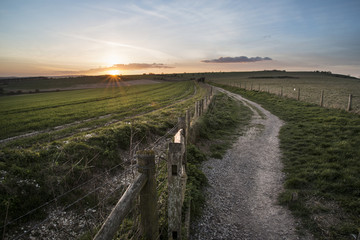 Fototapeta premium Beautiful Spring landscape of gate leading footpath into fields