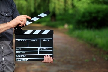 clapperboard in hand
