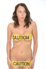 Fototapeta premium Sexy Sensual Naked Young Pin Up Woman Wearing Yellow Caution Tap