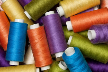 background from multi-colored spools of thread