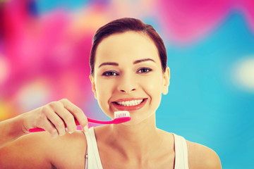 Woman brushing her teeth