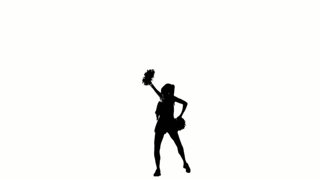 beautiful girl cheerleader dances on a white background with