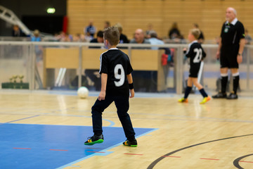 Obraz premium Kids indoor soccer match