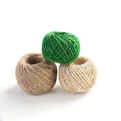 Three isolated skeins of thread