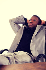 Black man relaxing in the office