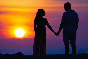 Fototapeta na wymiar silhouette of couple at beautiful sunset background