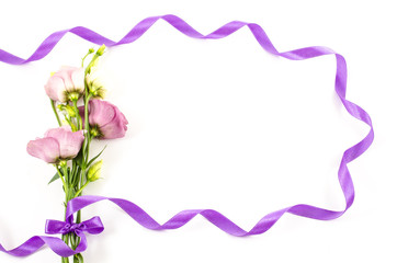 Fototapeta na wymiar Flower with purple ribbon on white background