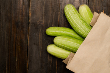 Fresh cucumber on wooden background