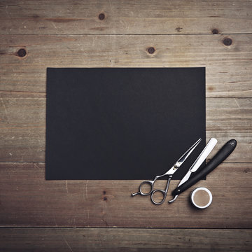 Old style barber tools and black page