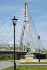 Modern bridge and Statue of Mermaid in Warsaw