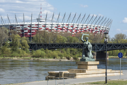 Fototapeta National Stadium and Statue of Mermaid in Warsaw, Poland