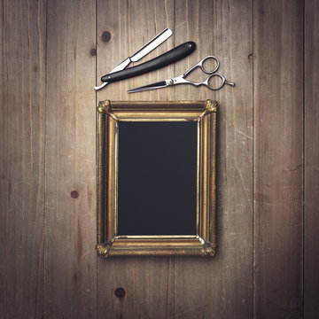 Vintage barber equipment and black canvas in a frame