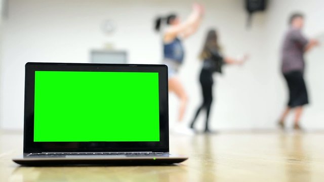 notebook - green screen - group of three friends dance