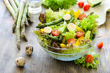 Fresh mix salad with green asparagus and eggs for healthy snack