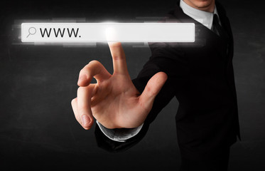 Young businessman touching web browser address bar with www sign - obrazy, fototapety, plakaty