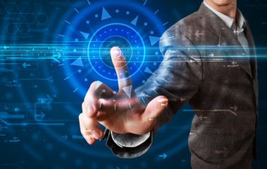 Handsome tech guy pressing high technology control panel screen