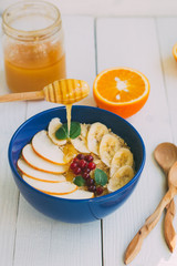 Oatmeal with fruit and honey for breakfast