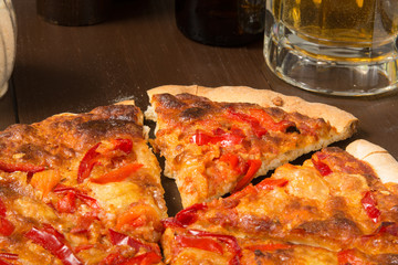 Sicilian style pizza with beer