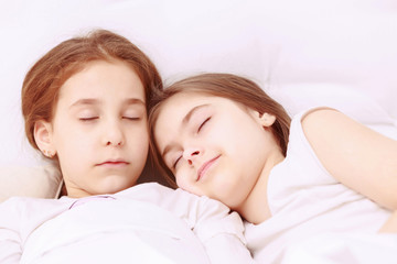 Two little cute sleeping girls