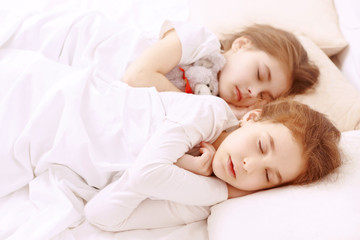 Fototapeta na wymiar Two little cute sleeping girls